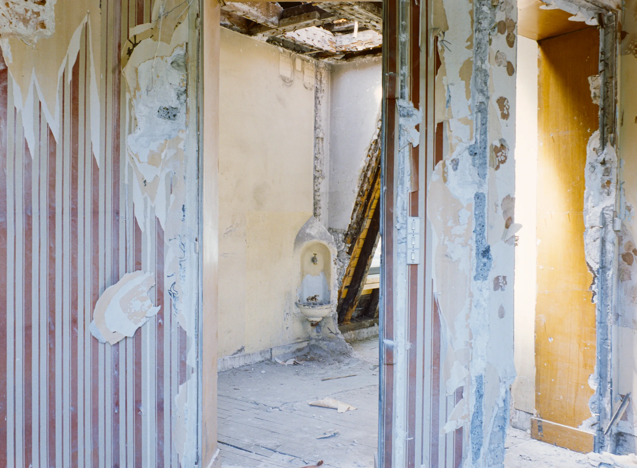 Partially stripped partitions and doorways inside the construction site